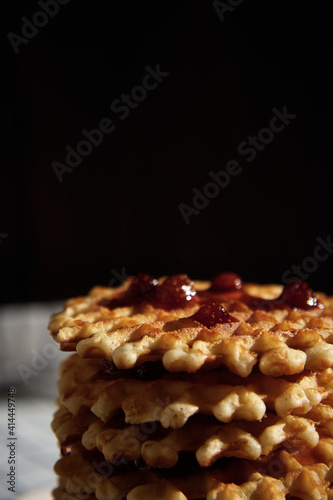 a tower of jam-soaked waffles stacked together