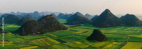 Panoramic view on mountains and rapeseed fields in Luoping, Yunnan, China