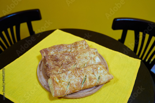 Freshly baked homemade savory puff pastries patties, rollini photo