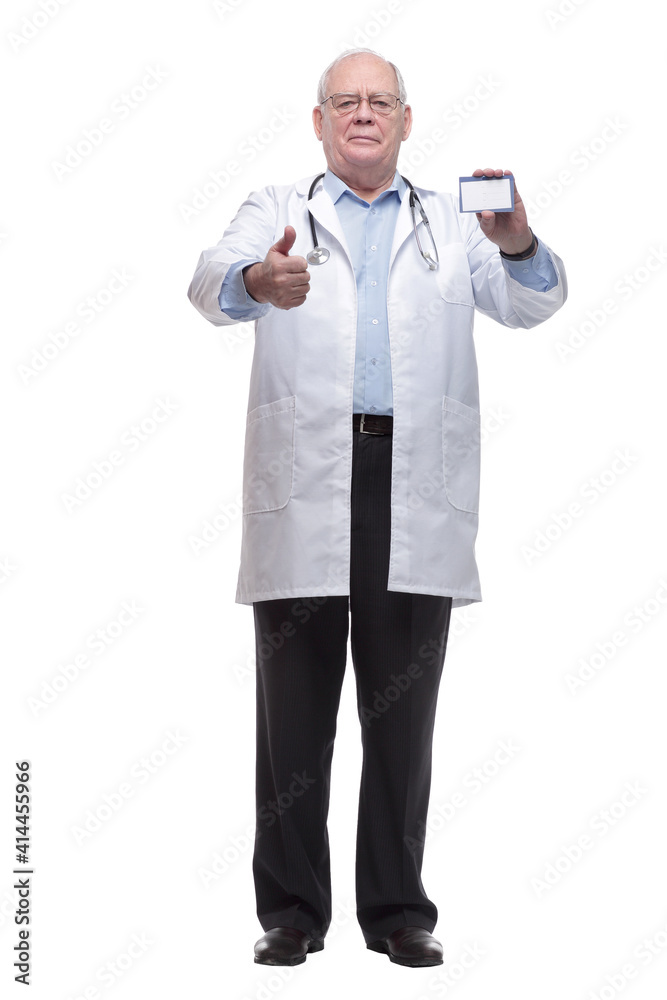 in full growth. doctor in protective mask showing his visiting card. in full growth. doctor in protective mask showing his visiting card.
