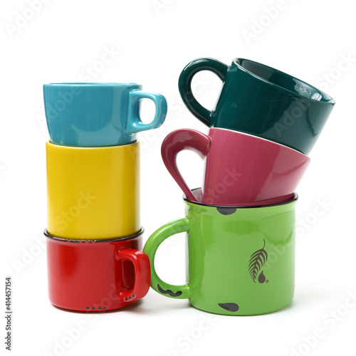 Colorful cups on white background 