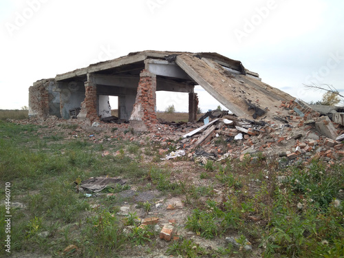 destroyed brick building abandoned house in the grass broken foundation