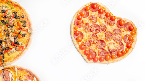three different kinds of pizzas