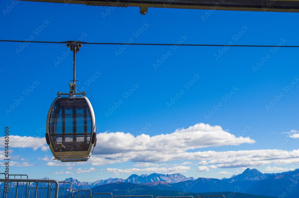 cable car takes tourists to the high mountains under the summer sun cable car takes tourists to the high mountains under the summer sun
