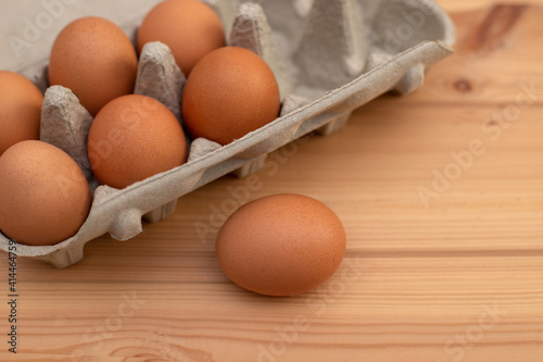 eggs in a package on a wooden table, ingredients