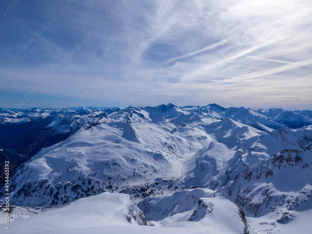 Beautiful and serene landscape of mountains covered with snow in Moelltaler Gletscher, Austria. Thick snow covers the slopes. Clear weather. Perfectly groomed slopes. Massive ski resort.