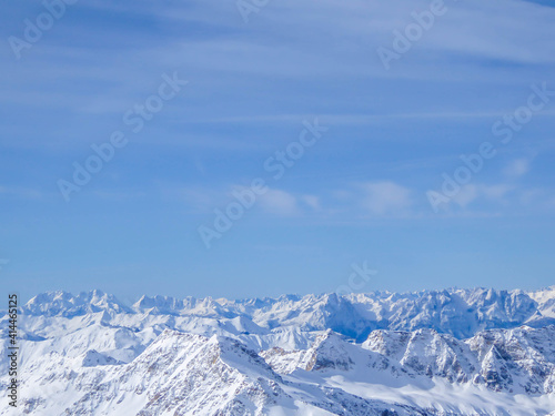 Beautiful and serene landscape of mountains covered with snow in Moelltaler Gletscher, Austria. Thick snow covers the slopes. Clear weather. Perfectly groomed slopes. Massive ski resort.