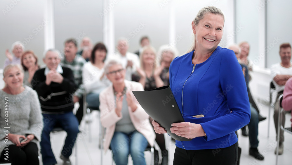 Businesswoman addressing colleagues at office meeting Businesswoman addressing colleagues at office meeting