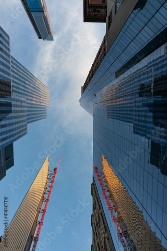 Looking up at Tall and Modern Glass Residential Skyscrapers in Midtown Manhattan of New York City