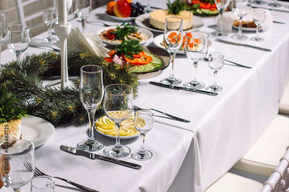 Fototapeta premium Festive wedding table set for dinner, beautiful expensive dishes.