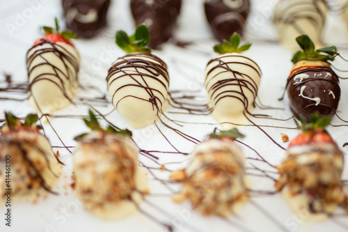 Closeup of chocolate strawberries homemade recipe, piped decoration
