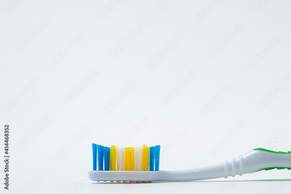 Toothbrush on a white background. Cleaning and hygiene of teeth. Caring for dental health Toothbrush on a white background. Cleaning and hygiene of teeth. Caring for dental health