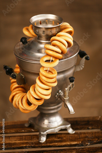 Russian tradition Samovar and bagels on table. photo