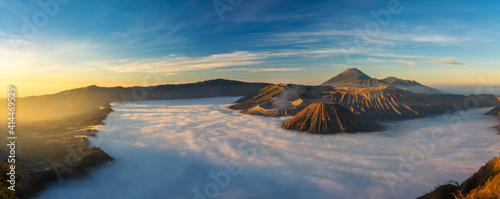 Bromo volcano mountai n at sunrise in East Java, Indonesia surrounded by morning fog.