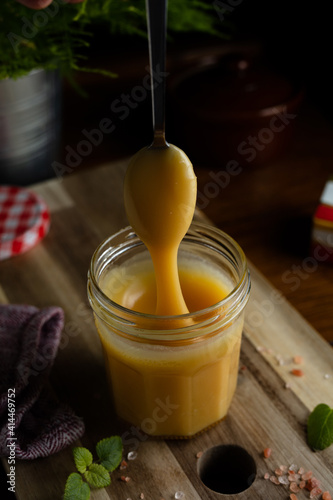 Homemade salted caramel in jam jar, butter cream sauce