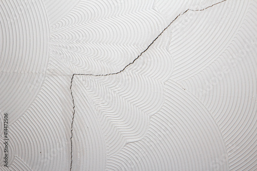 Artex ceiling cracking and breaking on the plaster board joins. Artex surface coating was a popular decorating choice during the 1970's and has since fallen out of favour in home renovations.