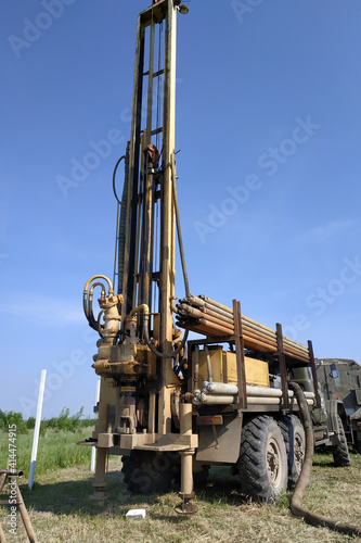 Canvas Print Machine for drilling wells for water, drilling a well in the garden, the drilling process close up