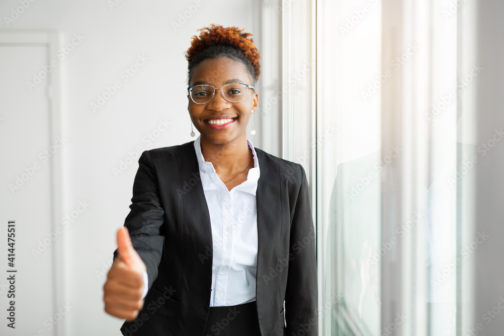 beautiful young african woman in office with hand gesture beautiful young african woman in office with hand gesture