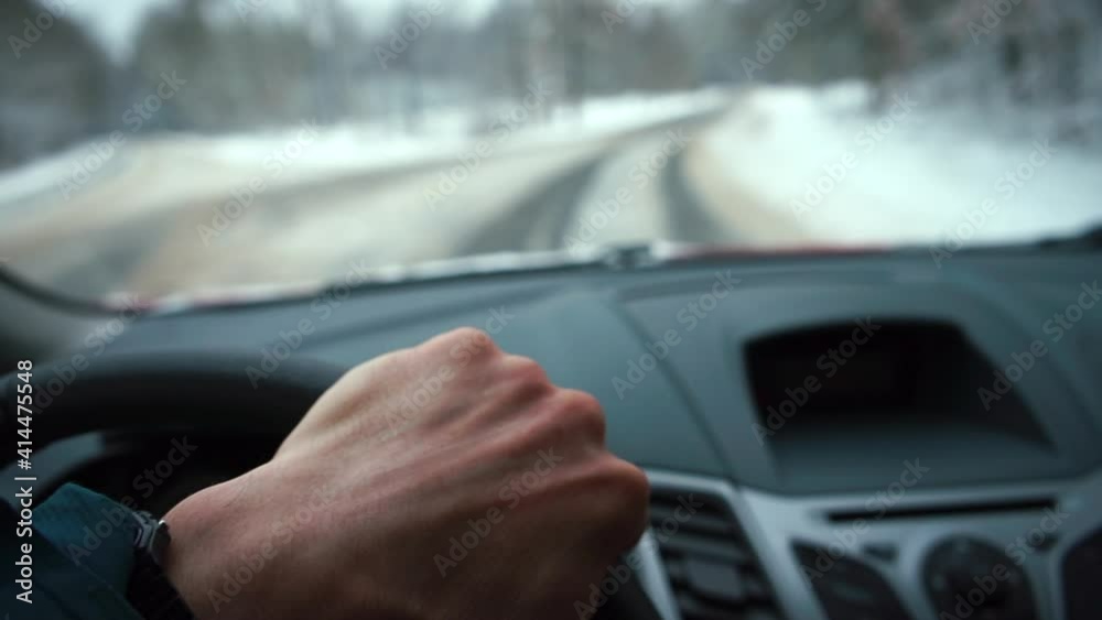 custom made wallpaper toronto digitalThe driver's hand drives a car on a winter road. Moves to the crossroads, makes a turn. Transportation of passengers using a transport vehicle.