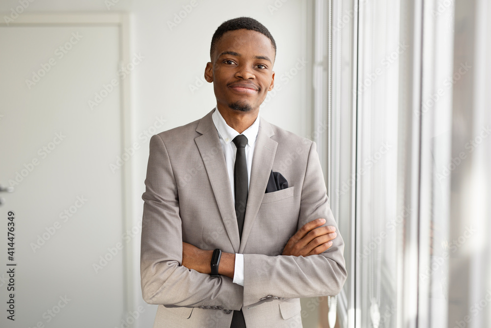 handsome young african man in suit at office handsome young african man in suit at office