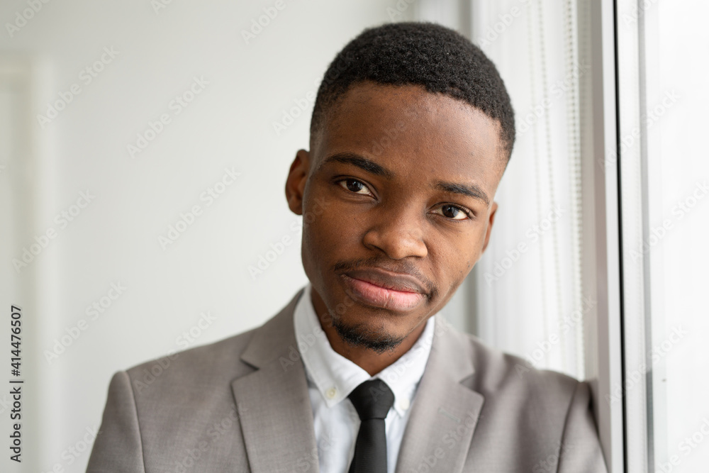 handsome young african man in suit at office handsome young african man in suit at office