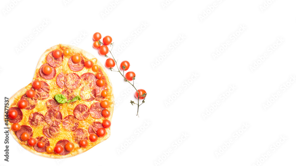 Fototapeta premium pizza in the shape of a heart and cherry tomato