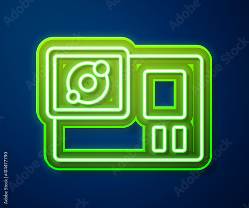 Glowing neon line Action extreme camera icon isolated on blue background. Video camera equipment for filming extreme sports. Vector.
