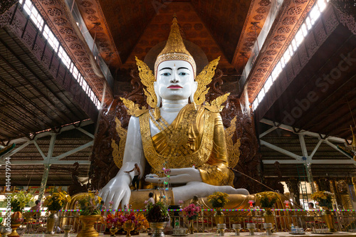 Buddha in gold, royal clothes,Yangon, Myanmar,gold Buddha statue (Ngar Htat Gyi Pagoda) photo