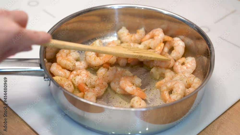 Prawns are fried in a frying pan Prawns are fried in a frying pan