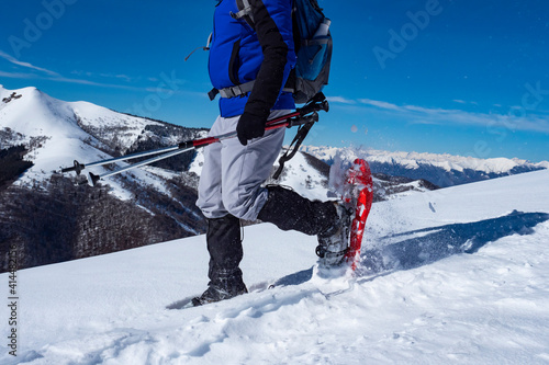 Close-up of snowshoeing activity in the italian alps