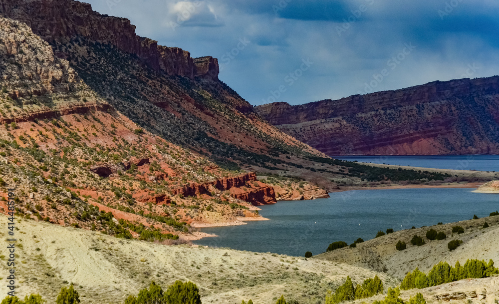 Mountainous landscape, a lake among the red mountains, islands in the lake. Utah, US