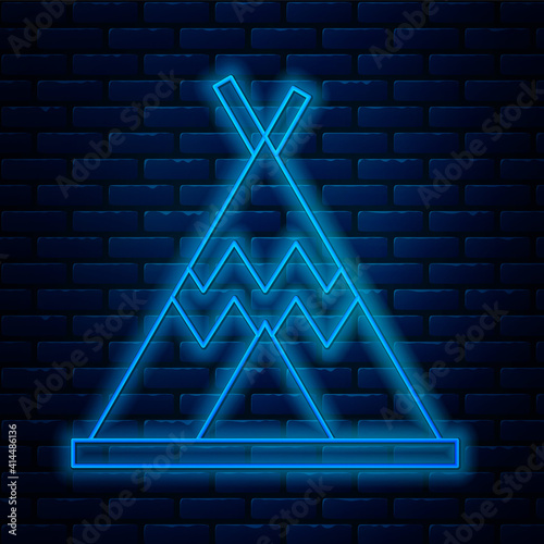 Glowing neon line Traditional indian teepee or wigwam icon isolated on brick wall background. Indian tent. Vector.