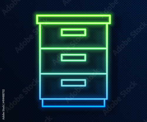 Glowing neon line Furniture nightstand icon isolated on blue background. Vector.