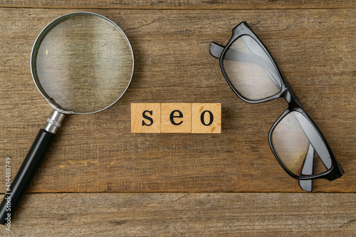 SEO, Search Engine Optimization ranking concept with magnifying glass and spectacles.  © Muhammad_Safuan