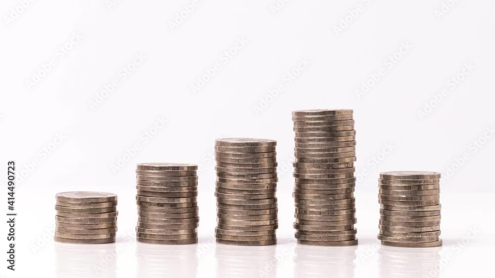 4k stop motion five piles of gold money coins decreasing fading disappear on white background, financial trading concept. 4k stop motion five piles of gold money coins decreasing fading disappear on white background, financial trading concept.