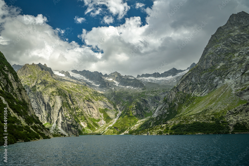 Beautiful view on Gelmersee lake surrounded by Swiss Alps