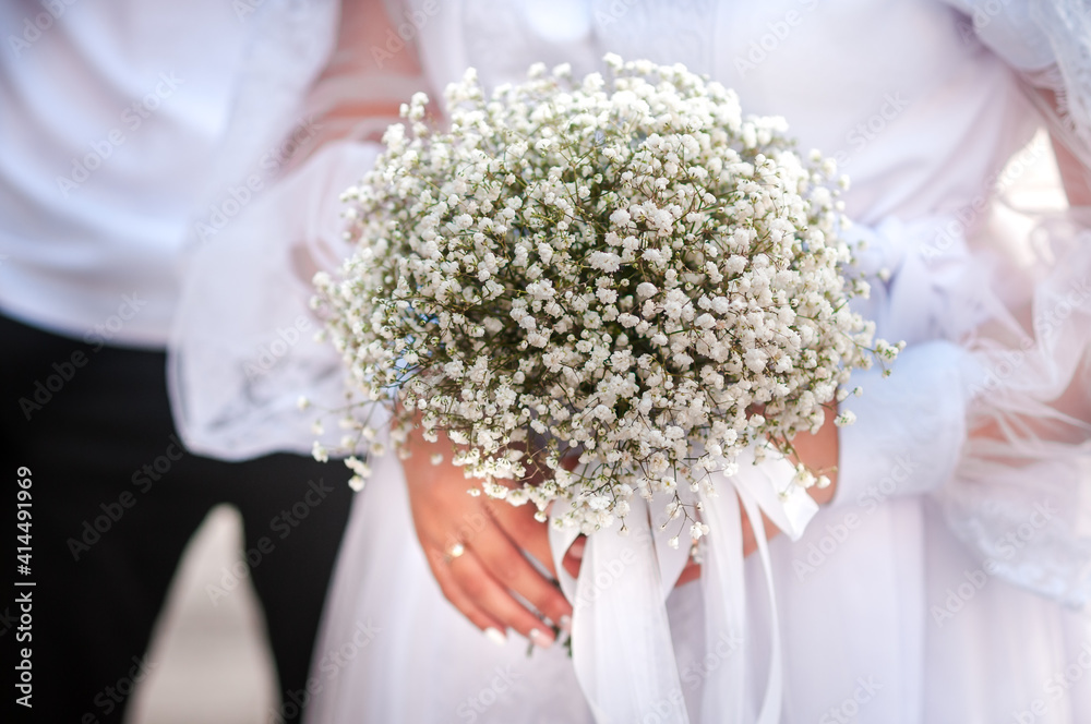 Bouquet of flowers in the hand of the bride Bouquet of flowers in the hand of the bride
