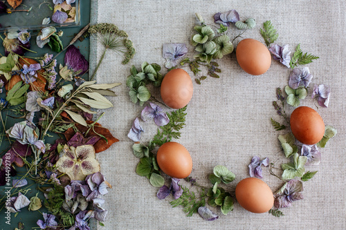 Easter wreath of dried flowers and eggs on fabric