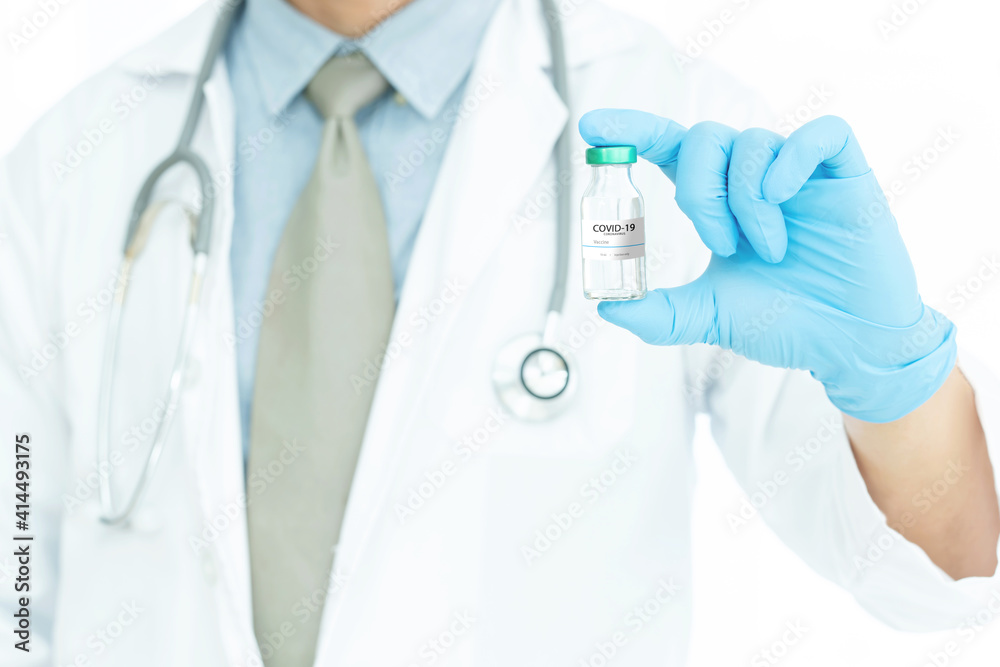 Development and creation of a coronavirus vaccine COVID-19 .Coronavirus Vaccine concept in hand of doctor blue vaccine jar. Vaccine Concept Development and creation of a coronavirus vaccine COVID-19 .Coronavirus Vaccine concept in hand of doctor blue vaccine jar. Vaccine Concept