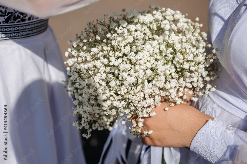 Bouquet of flowers in the hand of the bride Bouquet of flowers in the hand of the bride
