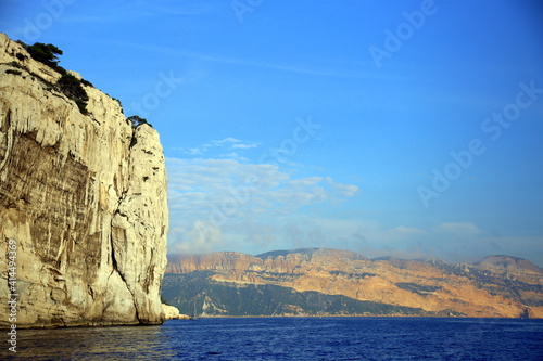 Cliff with colorful layered mountain in the background, Parc National des Calanques, Marseille, France