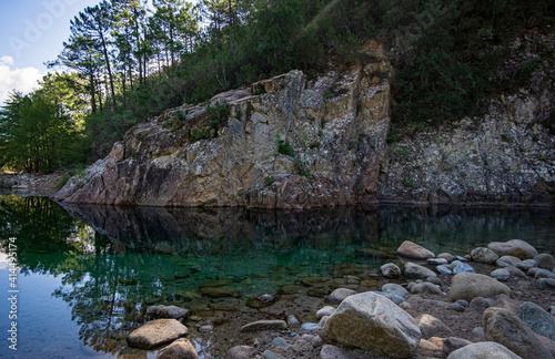 Rock formation and reflection in Solenzara River, Corsica, France