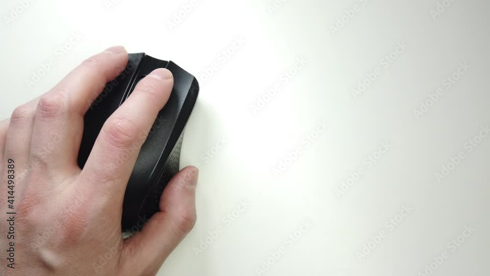 Mouse wireless closeup, hand tapping on black strict mouse pc personal computer technologies. Mouse wireless closeup, hand tapping on black strict mouse pc personal computer technologies.