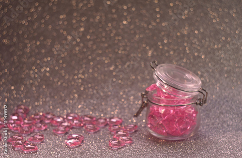 in a glass jar pink hearts for the holiday of February 14