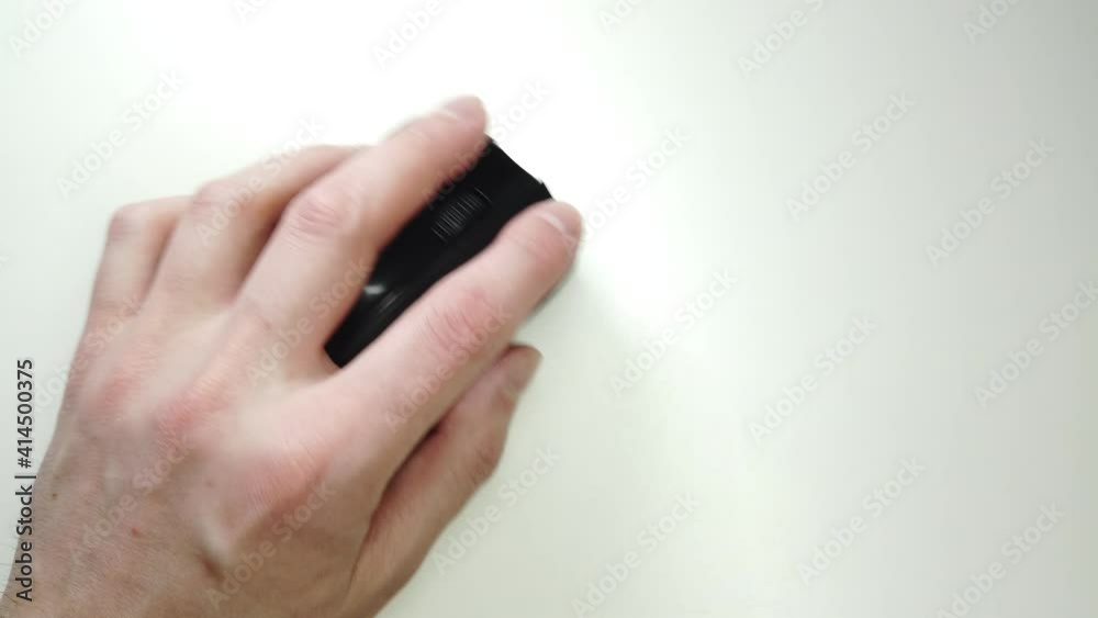 Mouse wireless closeup, hand tapping on black strict mouse pc personal computer technologies. Mouse wireless closeup, hand tapping on black strict mouse pc personal computer technologies.