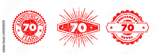 A group of 70 years anniversary logos drawn in the form of stamps, red frames for celebration. Grunge rubber stamp texture. Distressed texture stamp. Collection of postage stamps. Vector round stamps