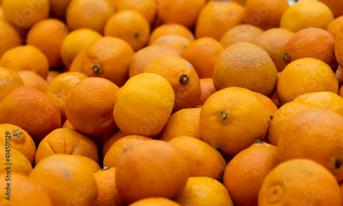Lots of fresh orange fruits tangerines