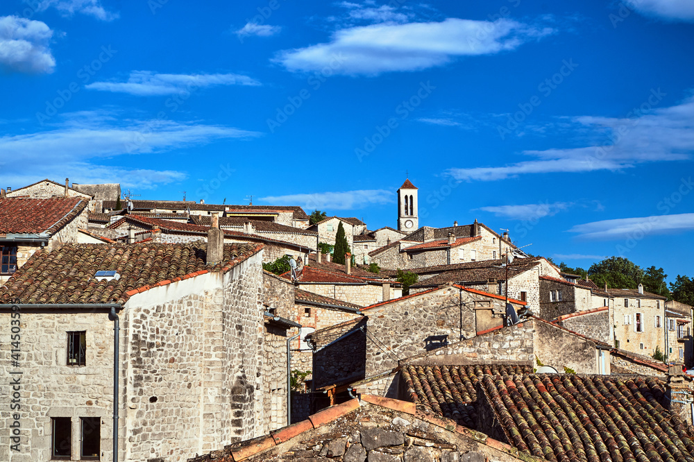 stone houses and belfry with clock in village of Balazuc stone houses and belfry with clock in village of Balazuc
