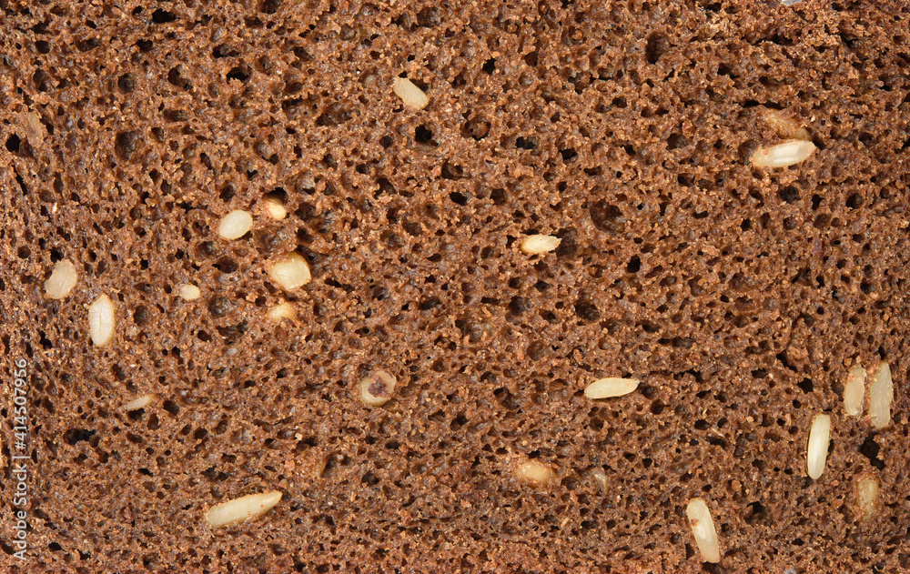 texture of a slice of bread made from rye flour with sunflower seeds texture of a slice of bread made from rye flour with sunflower seeds