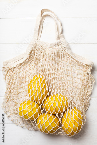 Ripe lemons in an eco-friendly bag